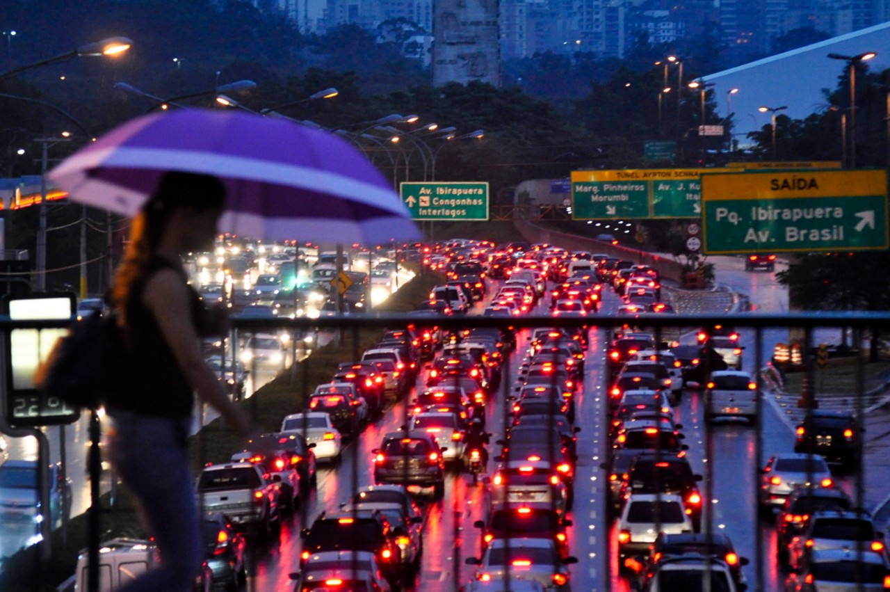 woman-walking-umbrella-overpass-roadway-getty-151902802.jpg